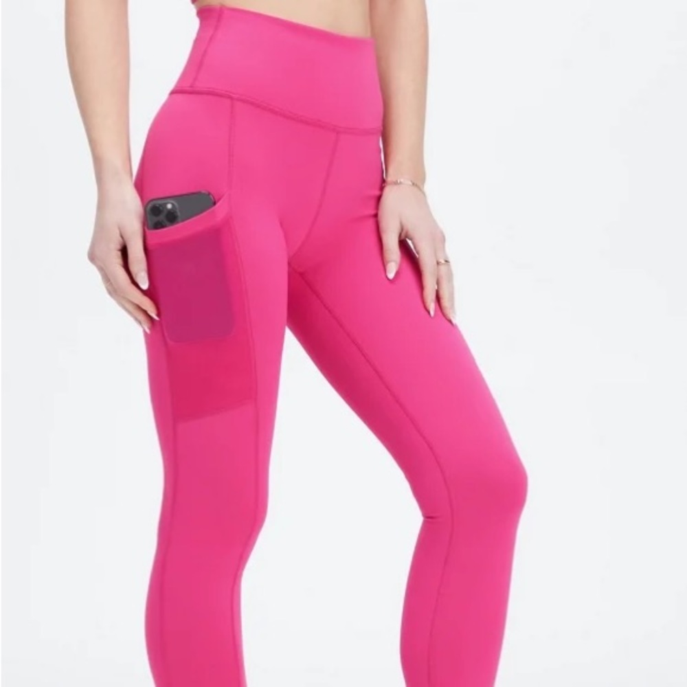 High waisted, high compression Fabletics Powerhold pink pocket leggings